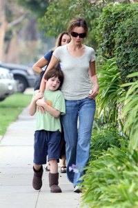 Liam in a cool pair of chocolate brown kids ugg style boots out with mum Calista Flockhart.